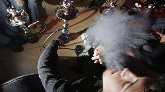 SAN JOSE, CA - JANUARY 18: Morgan Vincent smokes a hookah pipe at the Hookah Nites Cafe January 18, 2006 in San Jose, California. The ancient Middle-Eastern practice of smoking flavored tobaccos through a tall, ornate water pipe, better known as hookah, has become increasingly popular throughout the United States. Hookah lounges are becoming trendy in college towns and are appealing to people from all walks of life. (Photo by Justin Sullivan/Getty Images)